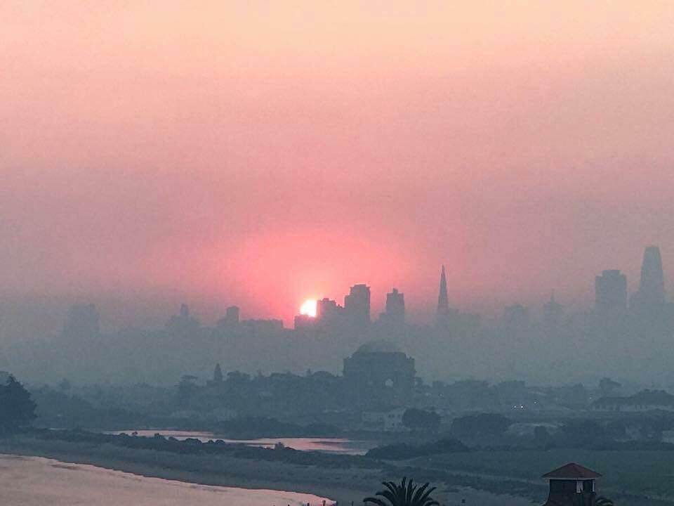 A photo shows the effects of smoke from the Northern California wildfires over San Franciso.